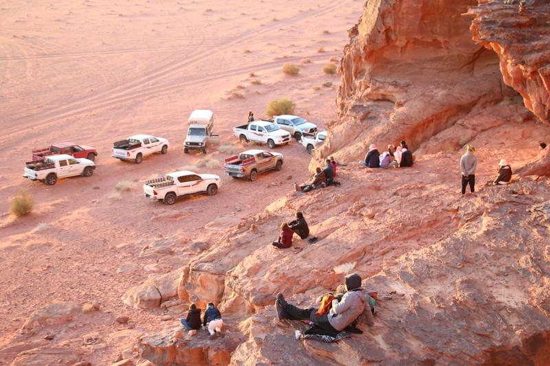 Jeeps parked at a desert viewpoint in Wadi Rum
