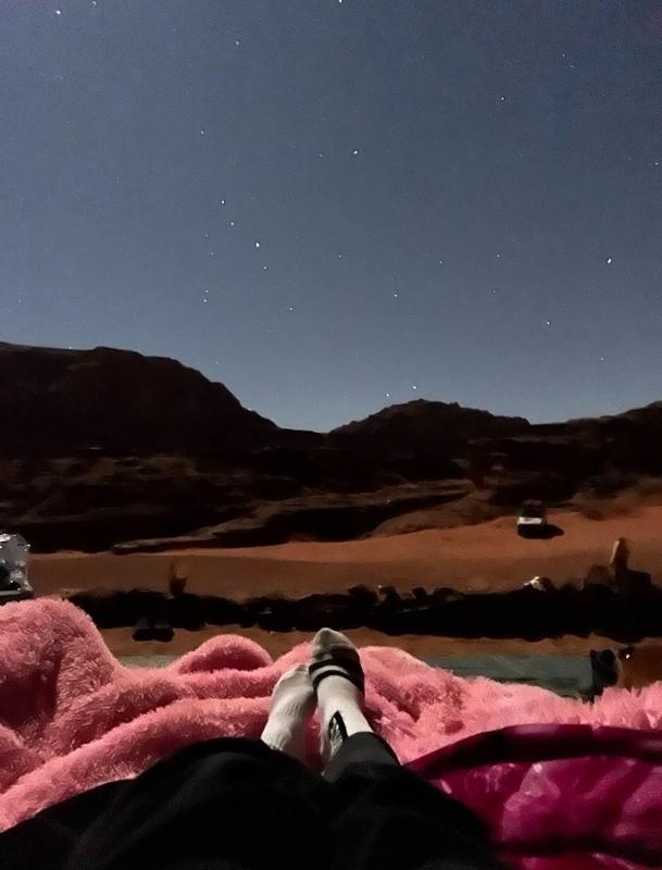 Blankets under the night sky in the desert